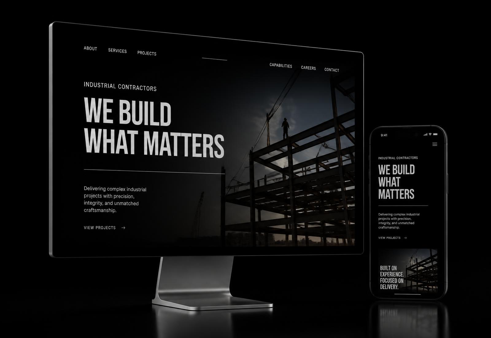 Desktop and phone displaying a dark industrial website concept